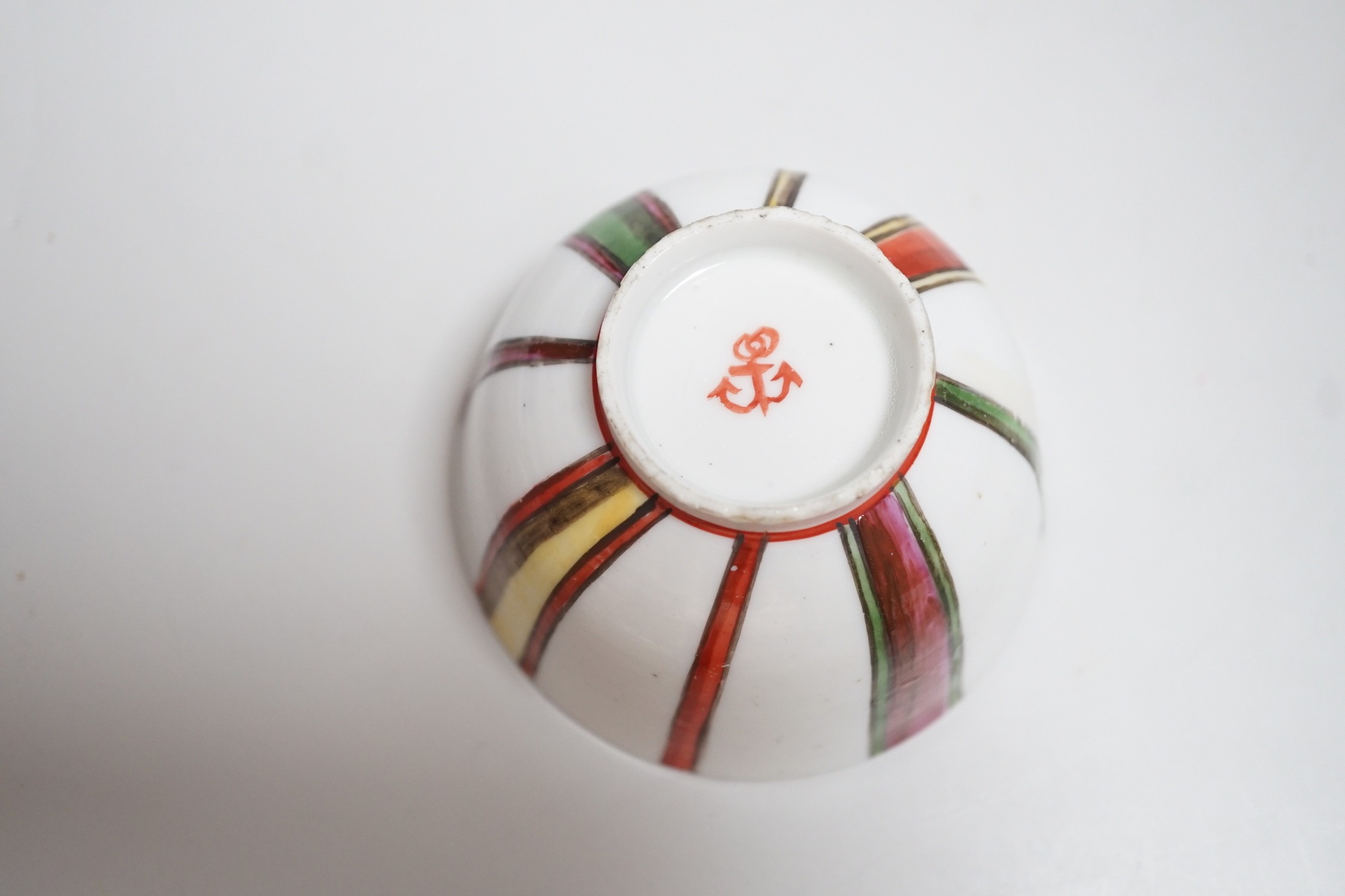 A Venice, Cozzi porcelain teabowl with polychrome vertical stripes, c.1765, 7.3cms diameter